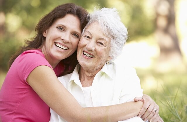 Dental implants: Two women showing their perfect smiles