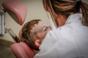 Boy getting a dental filling from a dentist in Harrow Middlesex